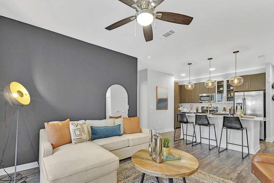 Spacious living room with modern decor in Oak & Ellum Apartments, a Greystar luxurious community