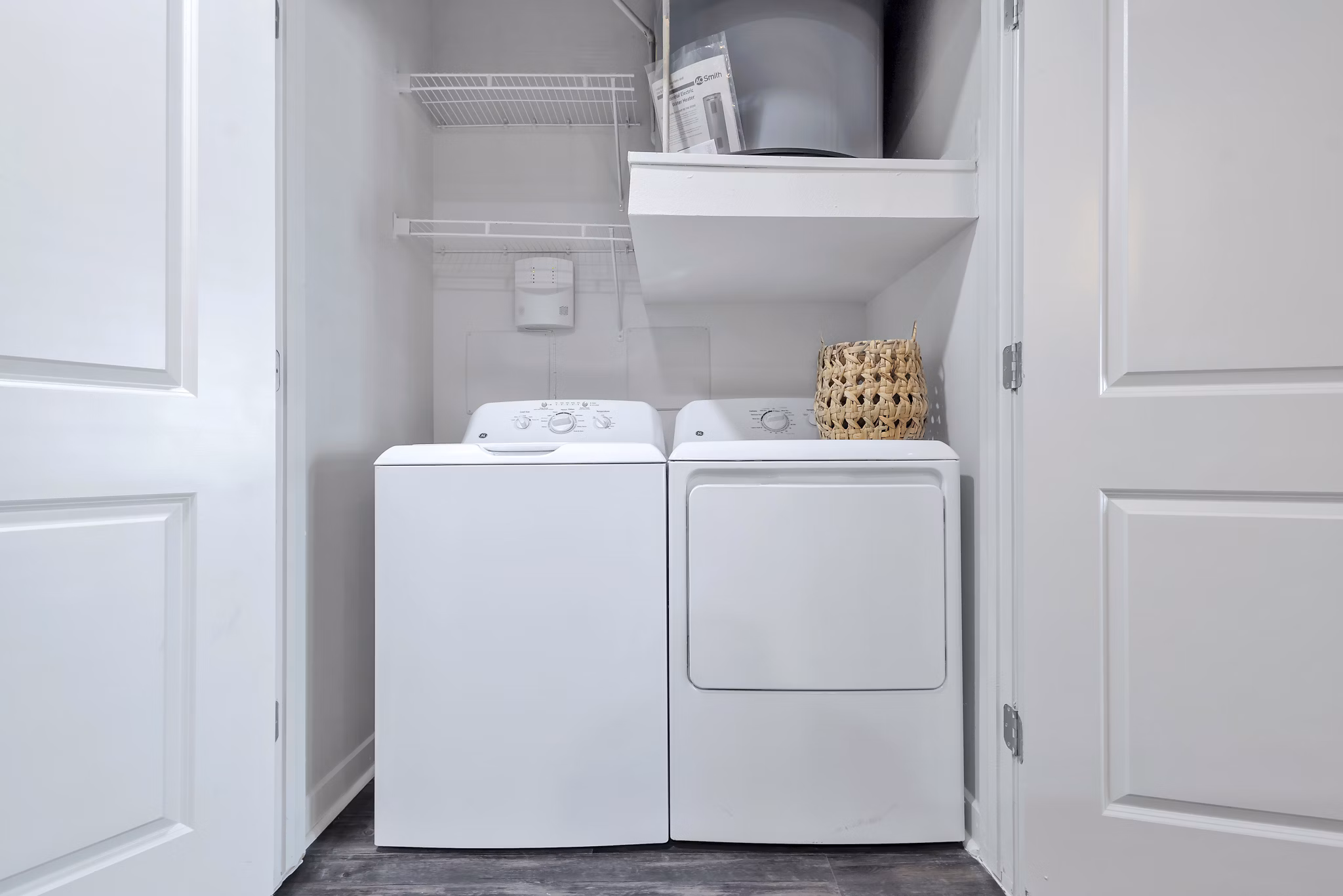 Oak & Ellum Apartments: Modern laundry room with stainless steel appliances
