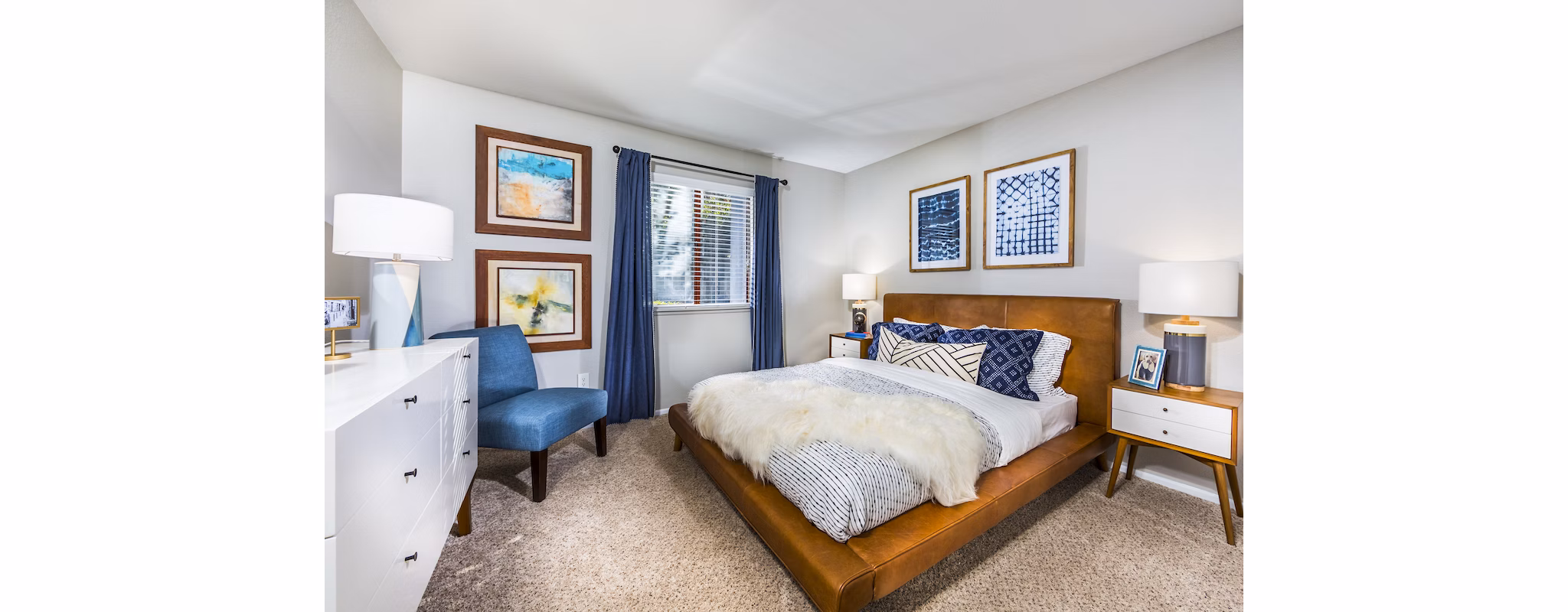 Bedroom featuring modern decor and large windows at Avana Rancho Cucamonga Apartments Perfect blend of comfort and style in a luxury setting