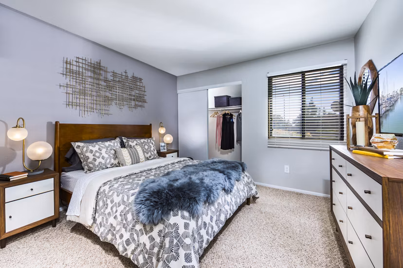 Bedroom with modern furnishings and natural light at Avana Rancho Cucamonga Apartments