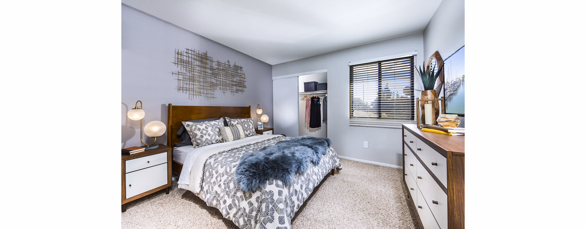 Bedroom with modern furnishings and natural light at Avana Rancho Cucamonga Apartments