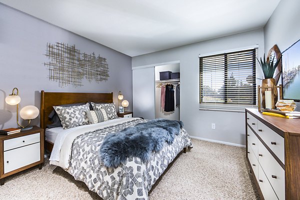 Bedroom with modern furnishings and natural light at Avana Rancho Cucamonga Apartments