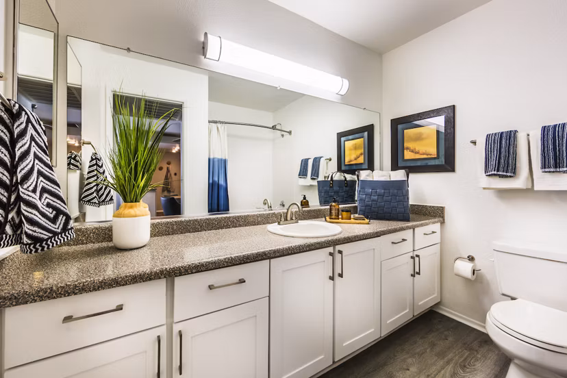 Modern bathroom with sleek fixtures and granite countertops at Avana Rancho Cucamonga Apartments