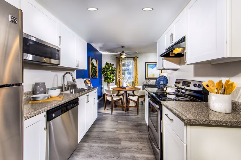Modern kitchen with stainless steel appliances in Avana Rancho Cucamonga Apartments