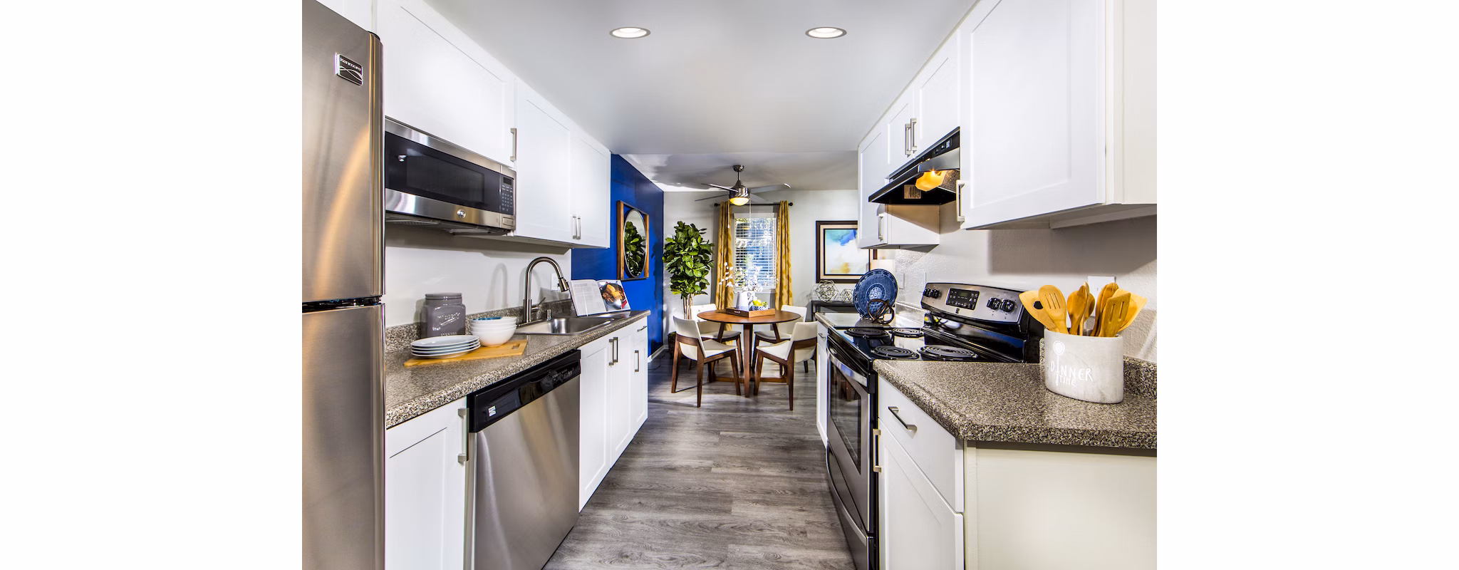 Modern kitchen with stainless steel appliances in Avana Rancho Cucamonga Apartments