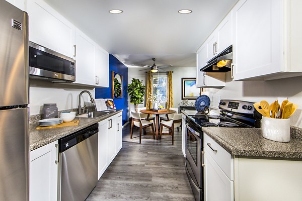 Modern kitchen with stainless steel appliances in Avana Rancho Cucamonga Apartments