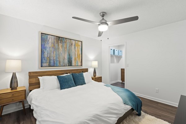 Bedroom interior with modern decor and large windows at Avana City Park Apartments, Greystar luxury community in an urban setting