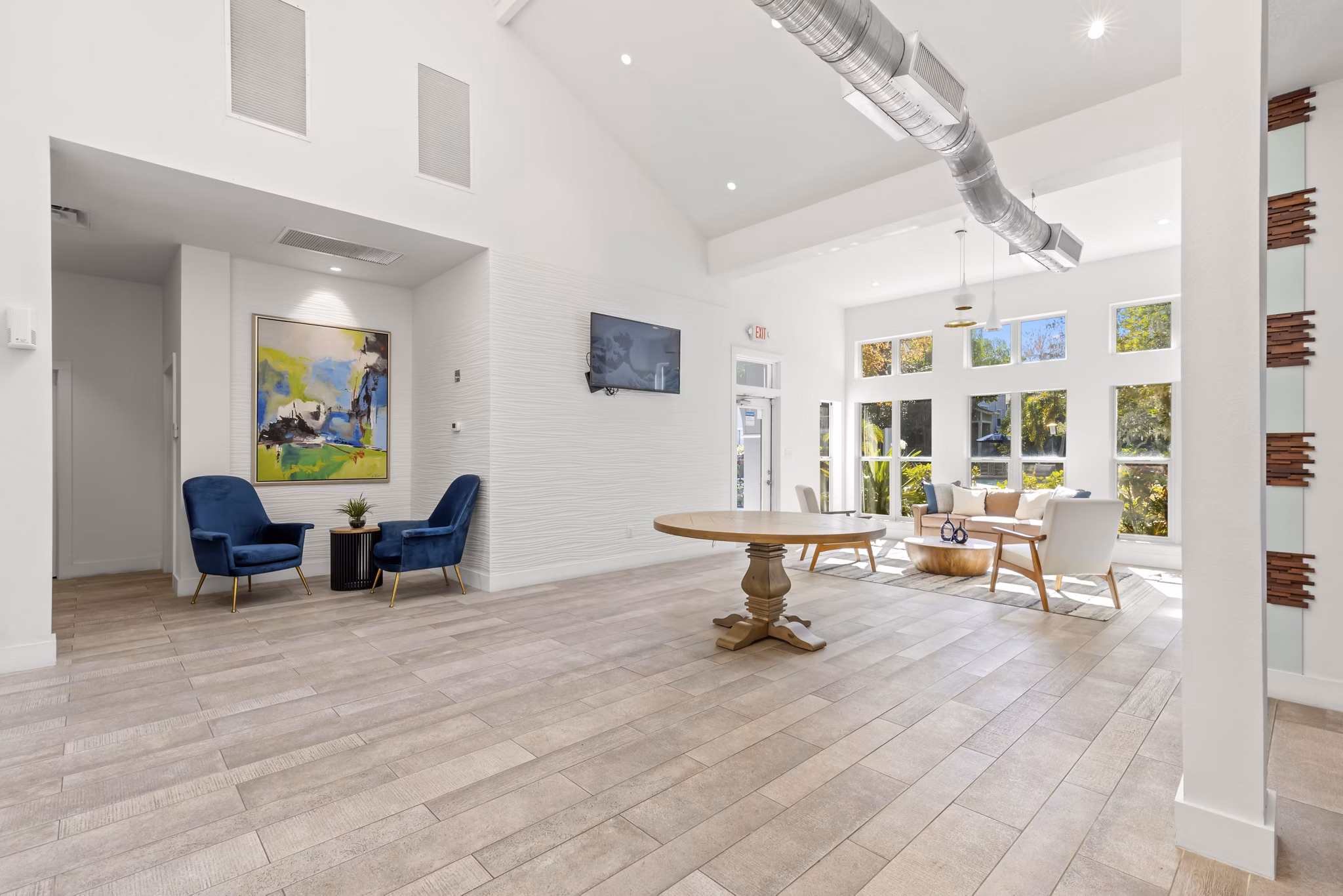 Clubhouse with modern furnishings and vibrant decor at Avana City Park Apartments