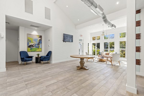 Clubhouse with modern furnishings and vibrant decor at Avana City Park Apartments