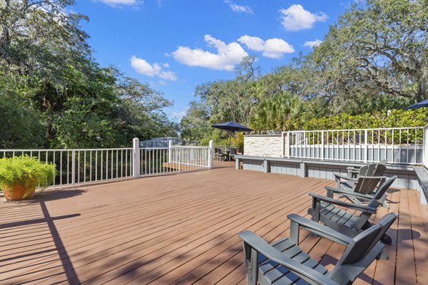 Inviting outdoor patio with modern seating at Avana City Park Apartments, perfect for relaxation and entertainment in a vibrant community setting