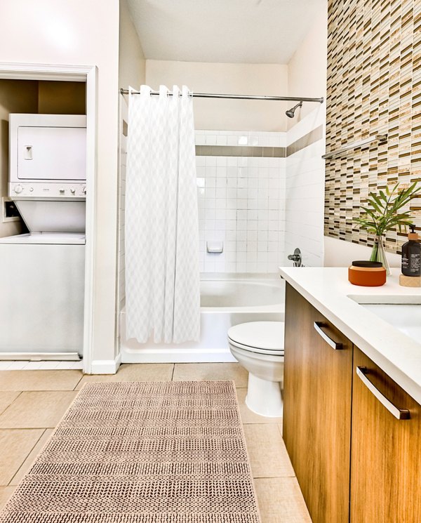 Luxurious bathroom with marble accents at The Stories Apartments