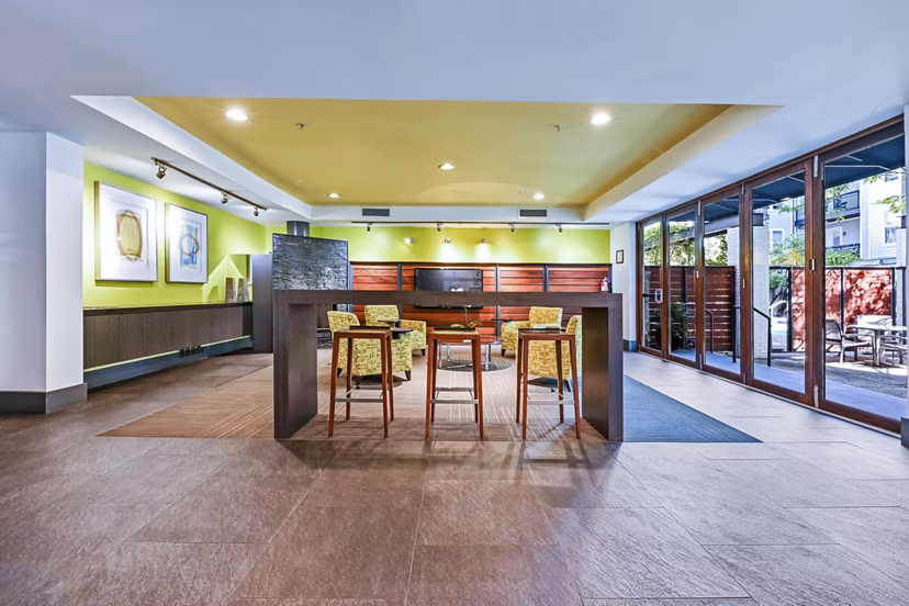 Luxurious clubhouse featuring modern decor at The Stories Apartments, perfect for social gatherings and events