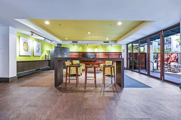 Luxurious clubhouse featuring modern decor at The Stories Apartments, perfect for social gatherings and events
