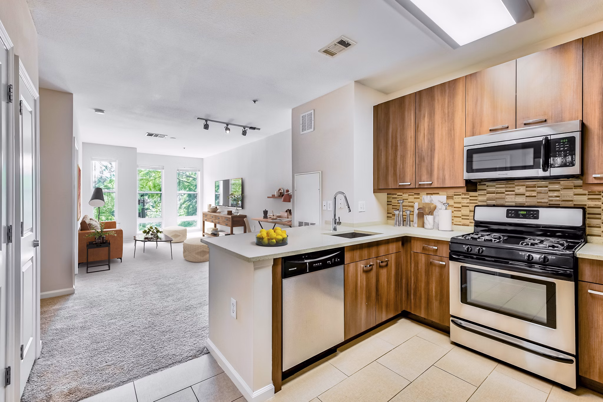 Modern kitchen featuring sleek cabinetry and stainless steel appliances in The Stories Apartments luxury community
