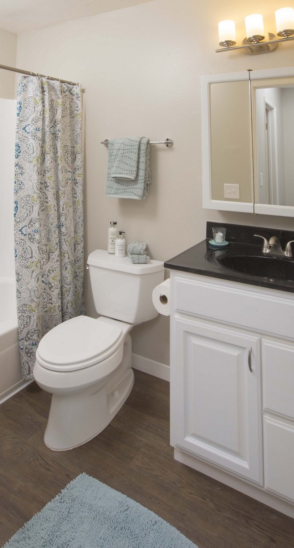 Bathroom featuring elegant fixtures and modern design at Amara Apartments