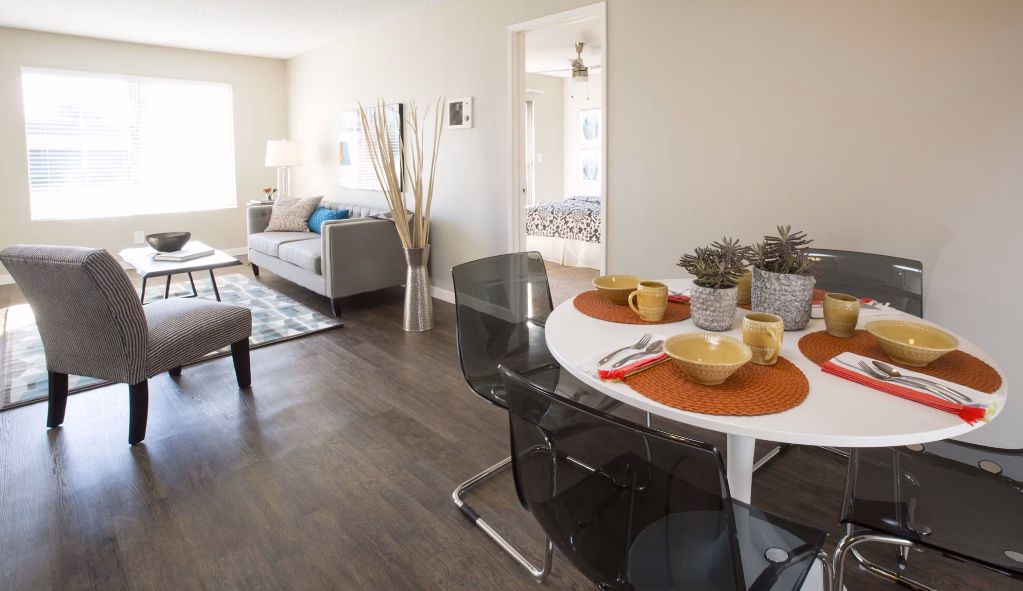 Amara Apartments: Elegant dining area with modern furnishings and ambient lighting