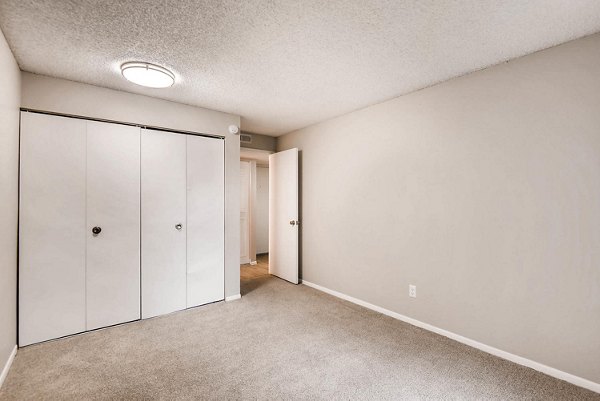 Cozy bedroom with modern furnishings at Copperwood Apartments
