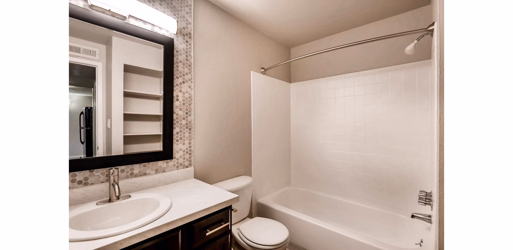 Bathroom with modern fixtures and granite countertops at Copperwood Apartments, luxury residences by Greystar