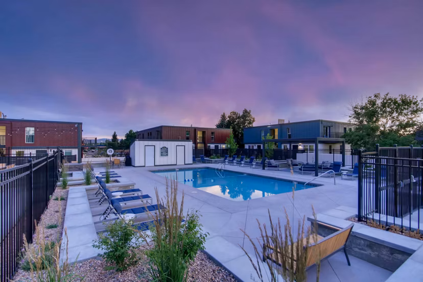 Outdoor swimming pool with lounge chairs at Copperwood Apartments, offering a relaxing retreat and luxury living experience