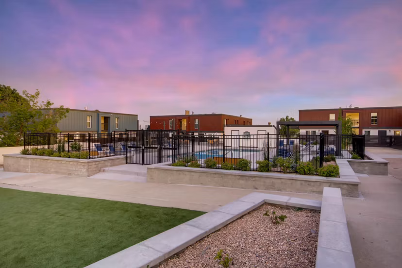Resort-style pool with lush landscaping at Copperwood Apartments