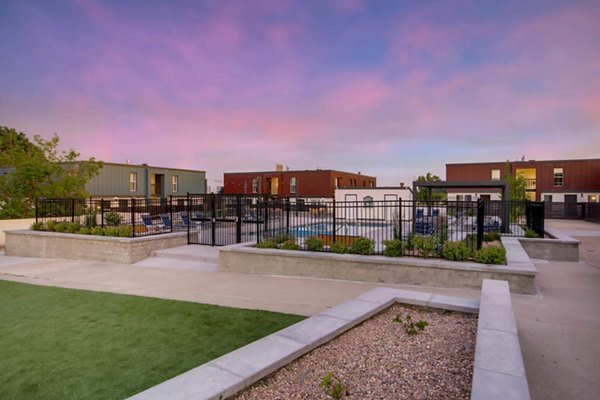 Resort-style pool with lush landscaping at Copperwood Apartments