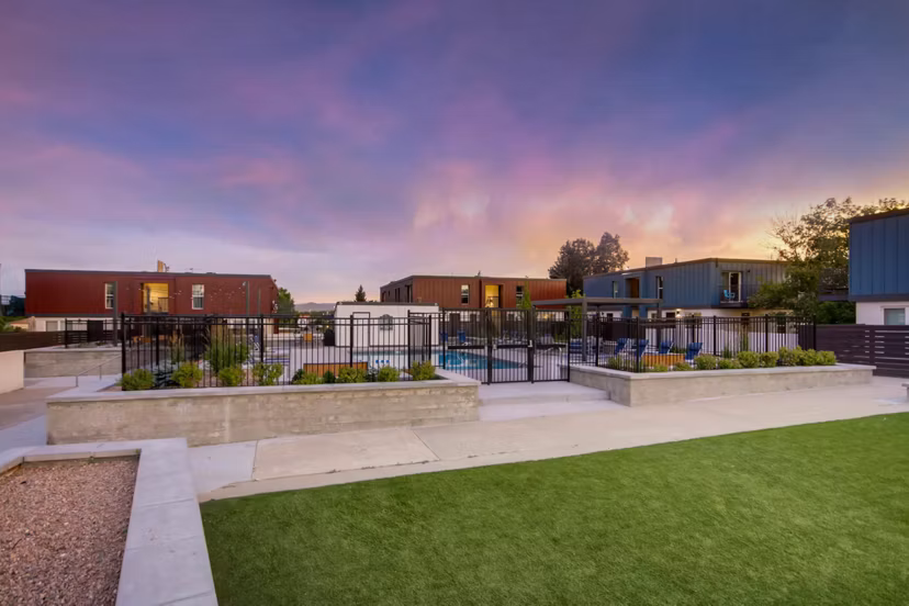 Resort-style pool surrounded by lush landscaping at Copperwood Apartments, offering relaxation and leisure in a luxury living environment