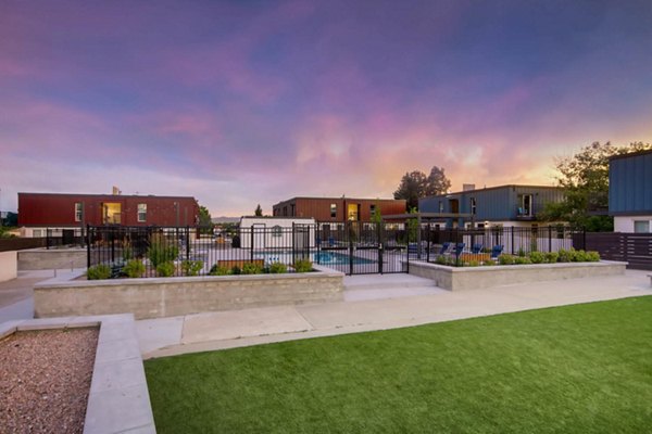 Resort-style pool surrounded by lush landscaping at Copperwood Apartments, offering relaxation and leisure in a luxury living environment