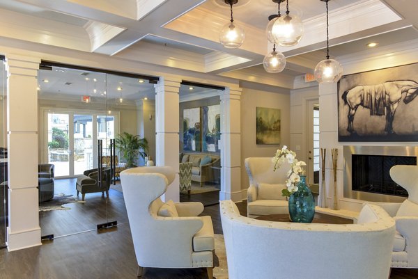 Clubhouse with modern seating and entertainment areas at Avana Uptown Apartments