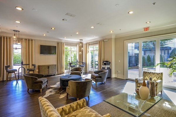 Clubhouse featuring modern furnishings and entertainment spaces at Avana Uptown Apartments