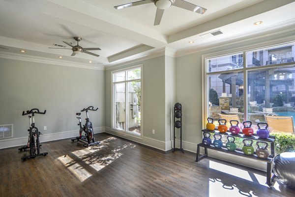 Yoga and spin studio equipped with modern fitness machines at Avana Uptown Apartments