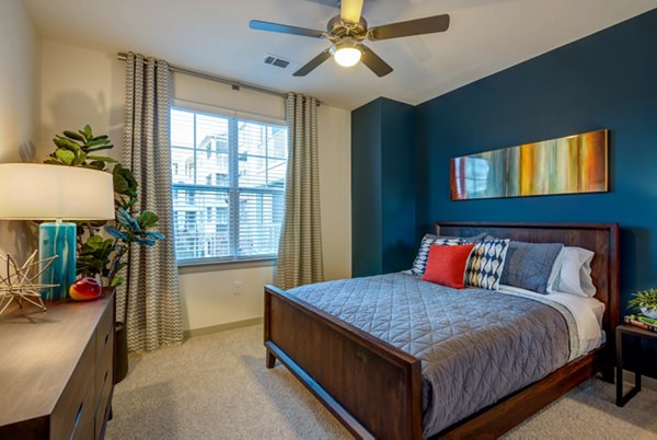 Contemporary bedroom featuring elegant decor at Element Ballantyne Apartments in Charlotte