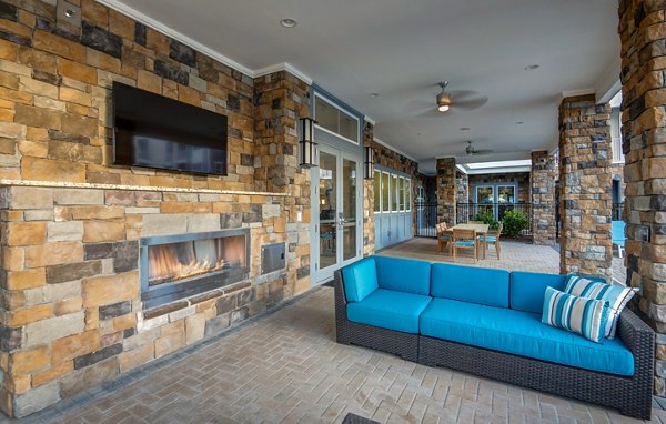 Spacious patio with modern seating at Element Ballantyne Apartments, perfect for outdoor relaxation