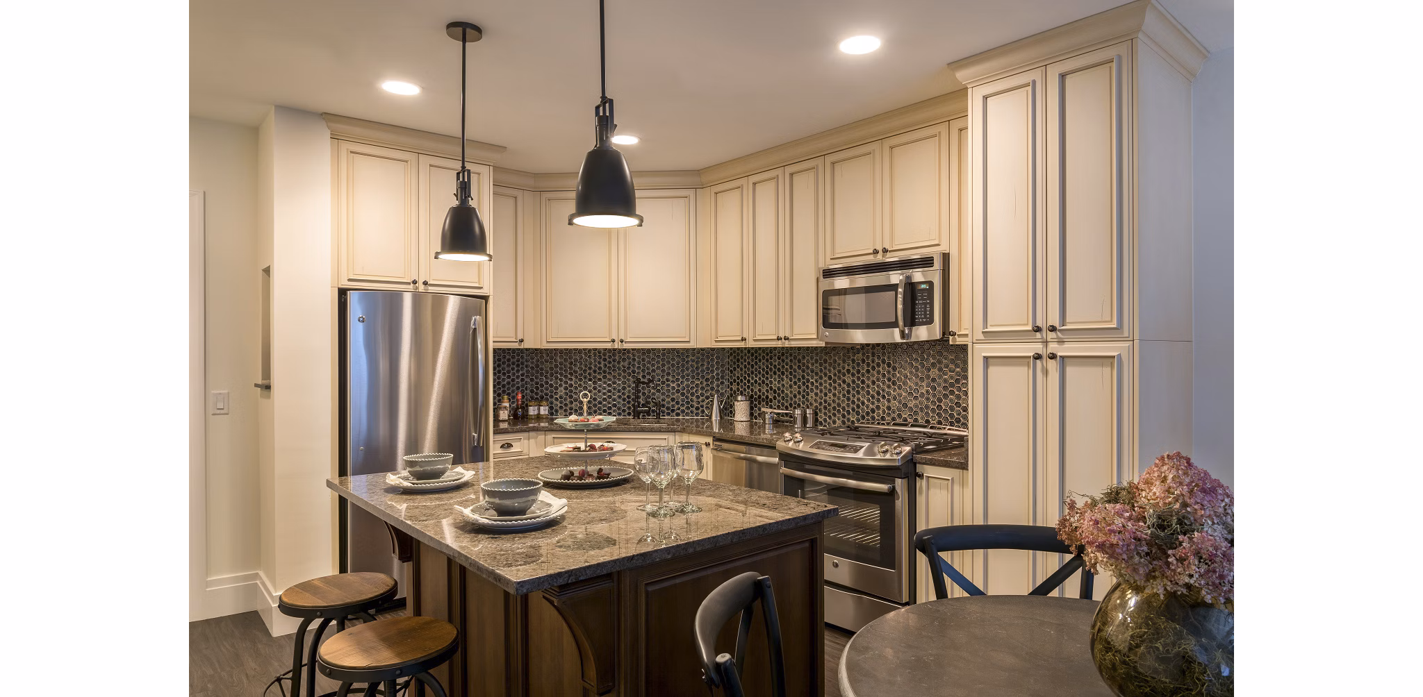 Modern kitchen with stainless steel appliances in Pike and Rose Pallas luxury apartments