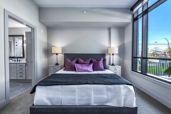 Bedroom showcasing elegant design and modern furnishings at Novel River Oaks Apartments