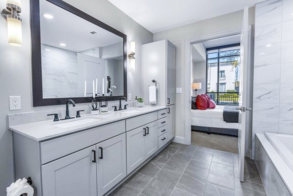Bathroom with sleek fixtures and spacious layout at Novel River Oaks Apartments