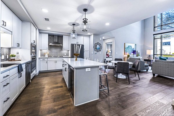 Modern kitchen with stainless steel appliances at Novel River Oaks Apartments