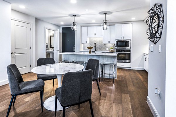 Elegant dining room with modern furnishings at Novel River Oaks Apartments