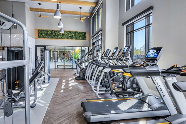 State-of-the-art fitness center at Novel River Oaks Apartments with modern equipment and spacious layout