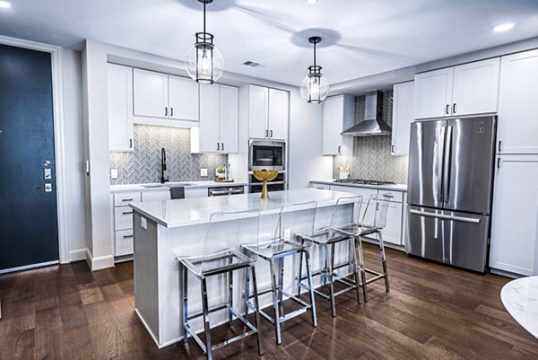 Modern kitchen entrance with sleek cabinetry in Novel River Oaks Apartments