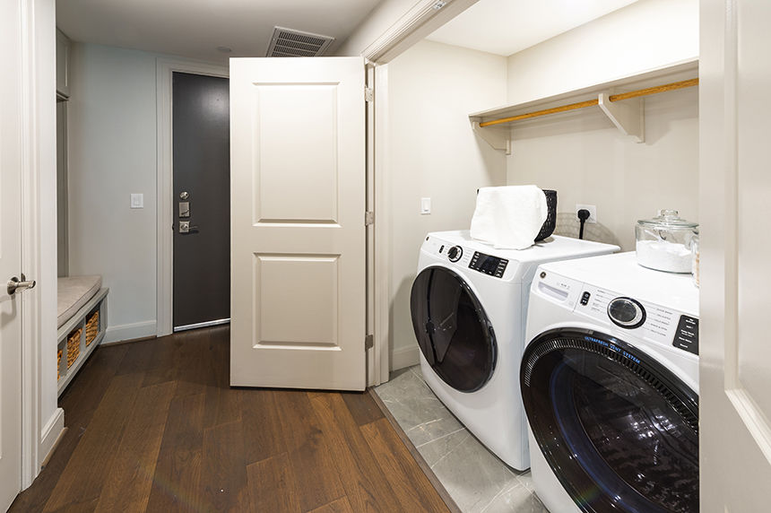 Laundry room at Novel River Oaks By Crescent Communities