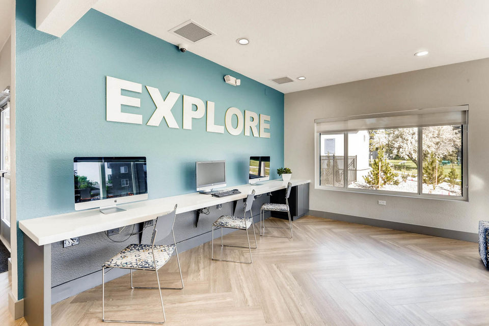 The Lodge Apartment Homes: Elegant clubhouse with modern decor and comfortable seating areas for residents