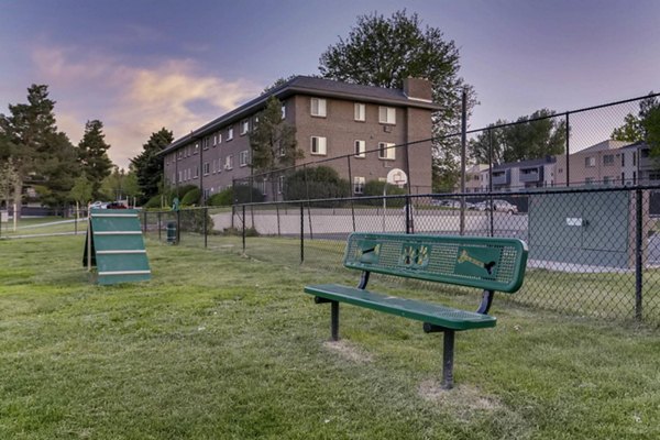 The Lodge Apartment Homes: Off-leash dog park with agility equipment in a serene wooded setting