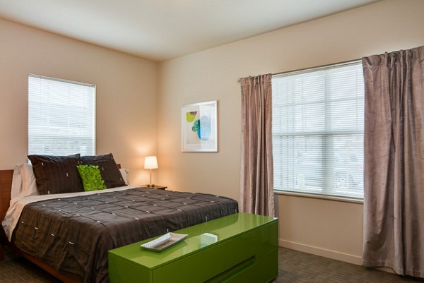 Elegant bedroom with modern design at The Bailey at Amazon Creek Apartments