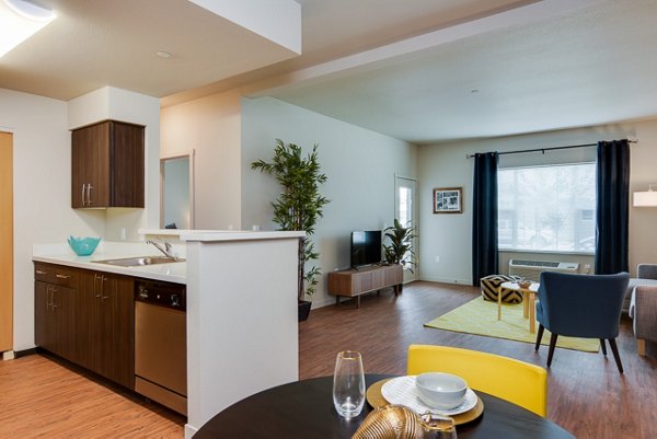 Dining room with sleek modern furniture in The Bailey at Amazon Creek Apartments