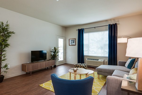 Spacious living room with contemporary decor at The Bailey at Amazon Creek Apartments