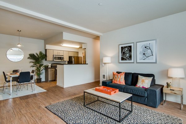 Spacious living room with modern furnishings at The Bailey at Amazon Creek Apartments