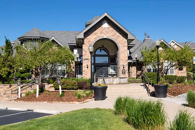 Aspen Ridge Apartments: Scenic view of luxury apartments in suburban setting