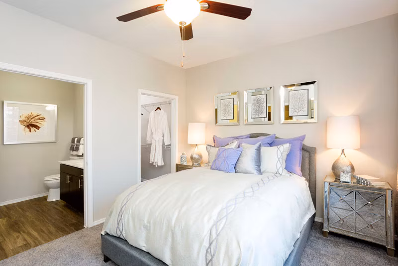 Spacious bedroom with modern decor at Aspen Ridge Apartments, featuring luxury amenities and comfortable living spaces