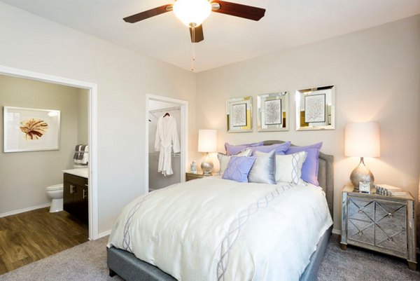 Spacious bedroom with modern decor at Aspen Ridge Apartments, featuring luxury amenities and comfortable living spaces
