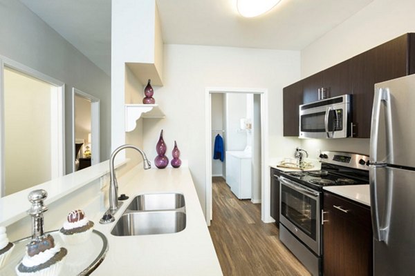 KITCHEN: Modern design with stainless steel appliances at Aspen Ridge Apartments